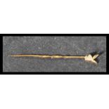 A 9ct gold tie pin of twist form having a Playboy