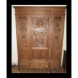 A 19th century French oak triple wardrobe armoire.