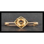 A 9ct gold marine influence bar brooch. Unmarked t
