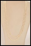 A long baroque pearl necklace chain of graduating