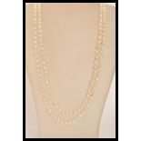 A long baroque pearl necklace chain of graduating