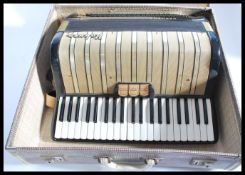 A vintage 20th century 1930s Hohner Carmen 2 piano