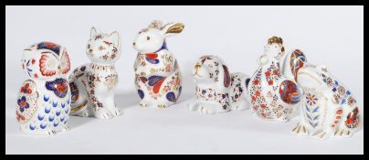 A collection of six imari pattern ceramic paperwei