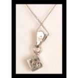 A 9ct white gold pave set diamond necklace pendant