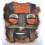 A vintage tribal  carved mask painted pigment and