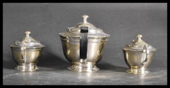 An early 20th century silver plated three piece ge