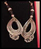 A pair of floral drop earrings set with freshwater