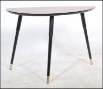 A vintage retro 20th century low tripod table havi