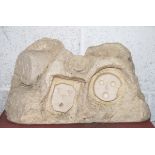 An abstract carved Bath stone sculpture of many st