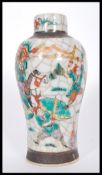 A 19th century Chinese crackle glazed vase urn depicting scenes of warriors in battle. Brown