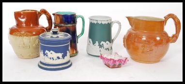 A group of vintage ceramic jugs, cups and pots to