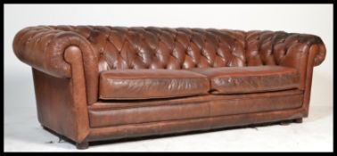 A good brown leather Chesterfield sofa settee of large size having button backed upholstery, 2 large