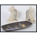 A pair of retro 20th Century onyx book ends in the form of seated Mexicans wearing sombreros