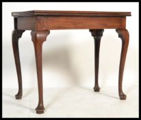 An 18th century George III solid cuban mahogany tea table / games table raised on cabriole legs with