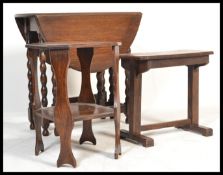 A 1930's oak Barleytwist drop leaf dining table together with an oak side table of square form