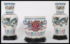 A set of three Franklin Mint ceramic Chinese inspired items from the Dance of the Celestial Dragon