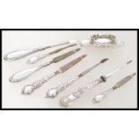 A collection of early 20th century silver hallmarked vanity picks to include 3 pairs with button
