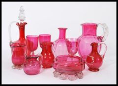A fantastic collection of 19th century Victorian cranberry glass to include decanter with stopper,