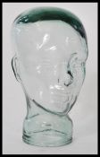 A unusual small 20th century moulded pressed glass phrenology type head shop display stand /