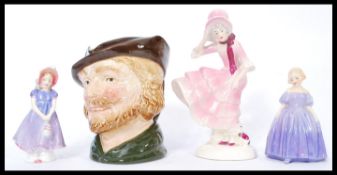 A group of Royal Doulton and other ceramics to include a Robin Hood character jug, two Doulton