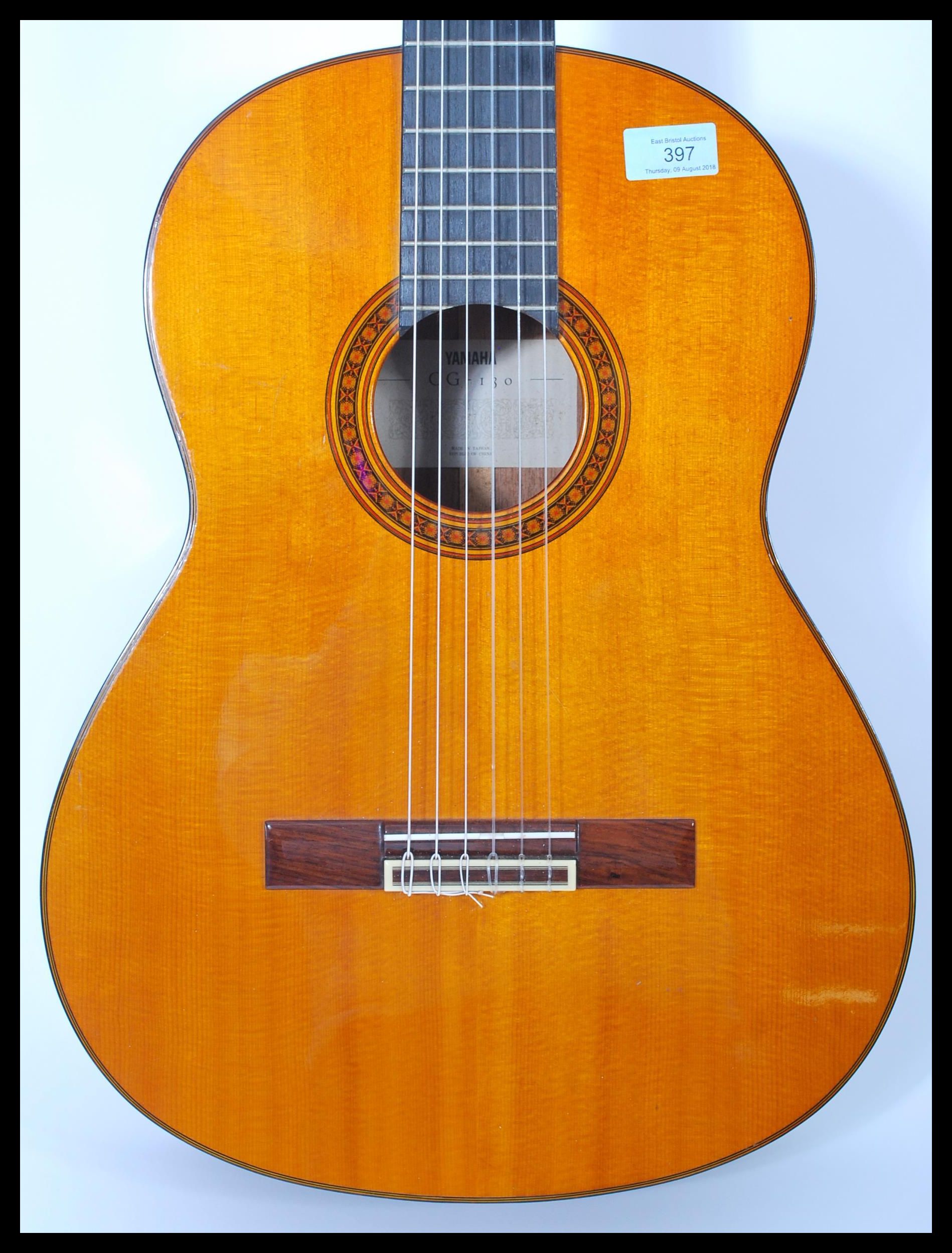 A vintage Yamaha six string acoustic guitar model CG 130 having a shaped hollow body with mother - Image 2 of 6