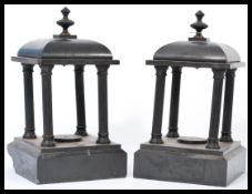 A pair of 19th century Victorian slate pagodas  / tea light stands being raised on square bases with