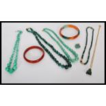 A group of malachite / jade type jewellery to include bead necklaces, heart pendant, Buddha pendant,