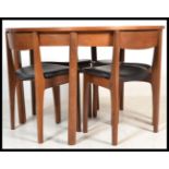 A vintage retro 20th century Nathan Caspian range teak circular extending dining table and chairs.