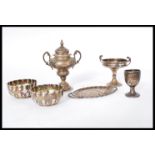 A group of silver hallmarked miniatures and dolls house furniture to include hallmarked goblet,
