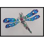 A large sterling silver and plique a jour brooch in the form of a dragonfly with pearl set wings and