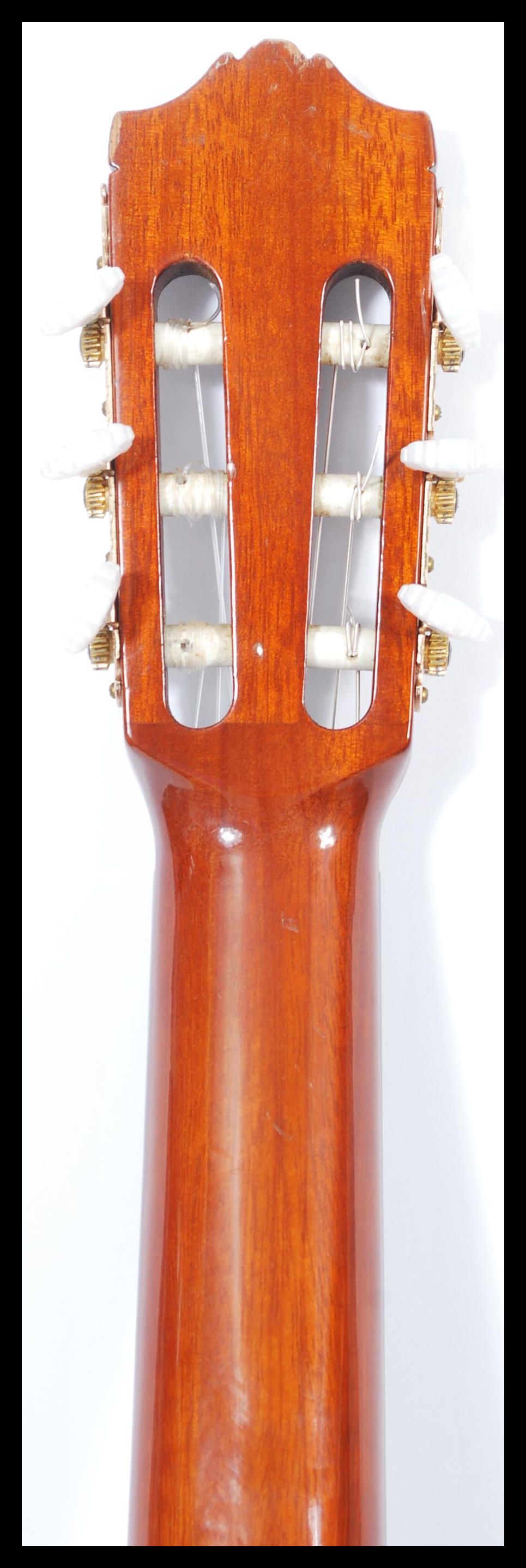 A vintage Yamaha six string acoustic guitar model CG 130 having a shaped hollow body with mother - Image 6 of 6