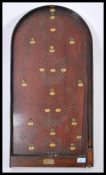 A vintage early 20th century wooden cased Amersham ' Scora ' bagatelle board with working spring and