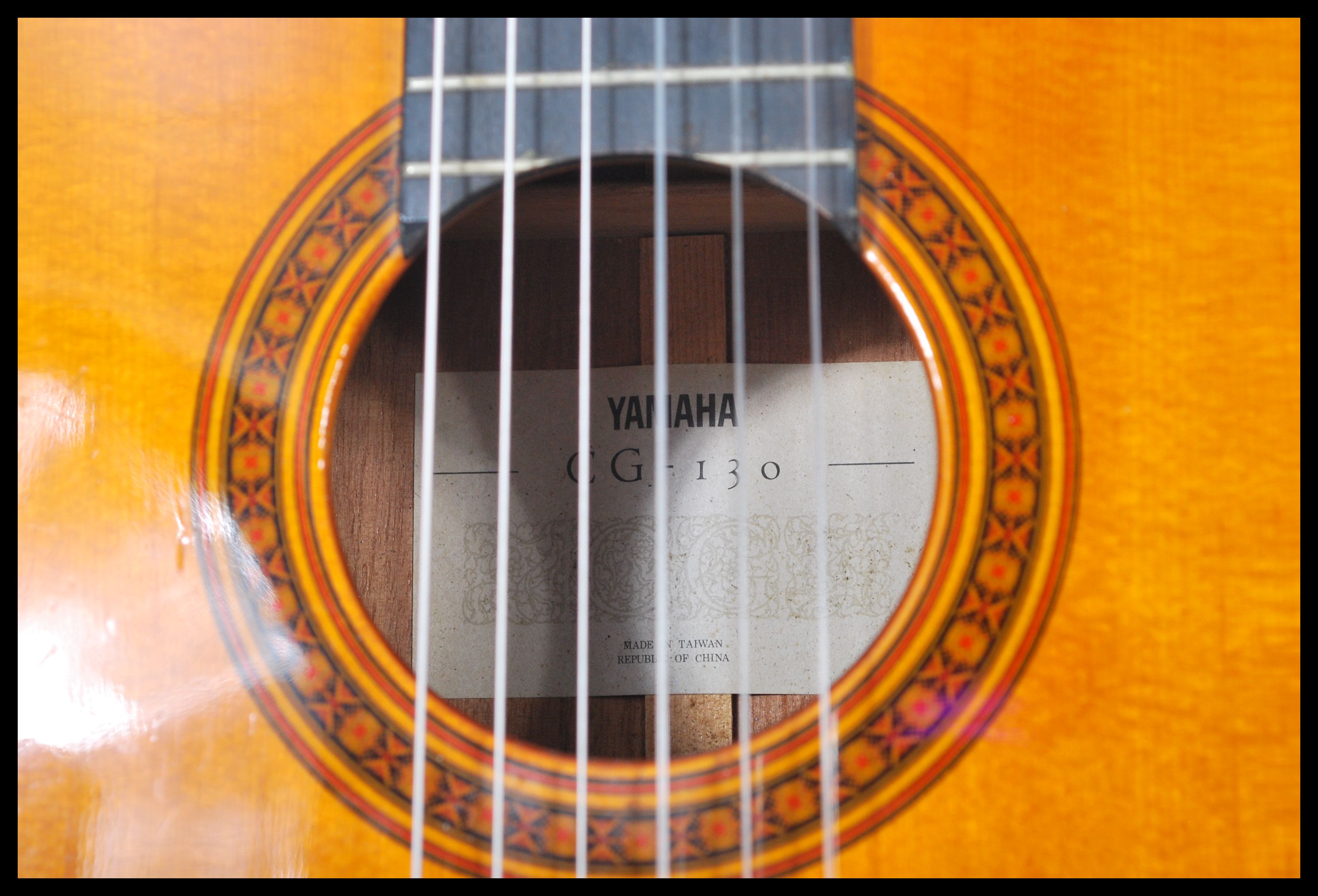 A vintage Yamaha six string acoustic guitar model CG 130 having a shaped hollow body with mother - Image 4 of 6