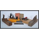 A collection of vintage 20th Century wood working planes to include box planes, a cased Stanley No 4
