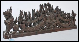 A 19th century carved Burmese hardwood cresting featuring Fu dogs and Buddhas. Please see images.
