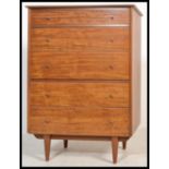 A good mid century Danish influence teak wood pedestal chest of drawers being raised on tapering