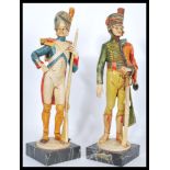 A pair of figures modelled as 18th Century soldiers / infantryman, one being a French soldier