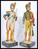 A pair of figures modelled as 18th Century soldiers / infantryman, one being a French soldier