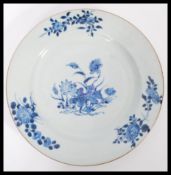 An 18th century Chinese Quinlong period plate having hand painted blue and white decoration of