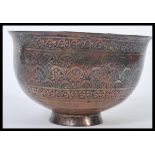 An 18th century Persian Islamic Middle Eastern prayer bowl constructed from two joined pieces of