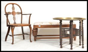 A 1930's mahogany and caned bergere armchair with wheelback arched rest over cane worked seat,