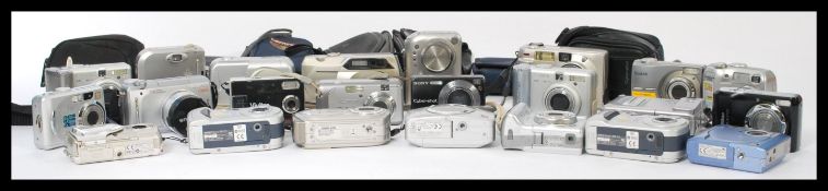 A collection of vintage cameras to include Canon Powershot A410, A560, A60, A70, Fujifilm Finepix