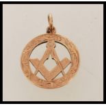 A 9ct gold Chester hallmarked necklace pendant of Masonic interest. Hallmarked to verso with bale