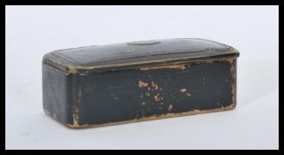 A 19th century papier mache Georgian snuff box of typical form having inset oval cartouche to the