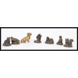 A group of bronze small paperweights depicting animals, dogs, mice etc. along with a small bronze