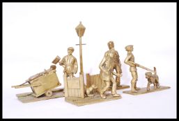 A collection of large brass cast figurines to include dustman and cart, hunter with dog, postman and