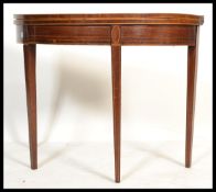 An 18th / 19th century George III mahogany and line inlaid demi lune tea table / games card table.