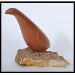 A vintage early 20th century North American carving of a bird. Hand carved from a single piece of