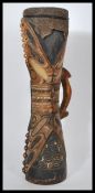 A Kundu hand drum Papua New Guinea, late 19th century, typical hour-glass form, carved from single