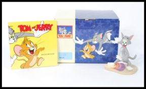 A group of five boxed ceramic figures to include Wedgwood Tom and Jerry, Beswick Tom and Jerry and a